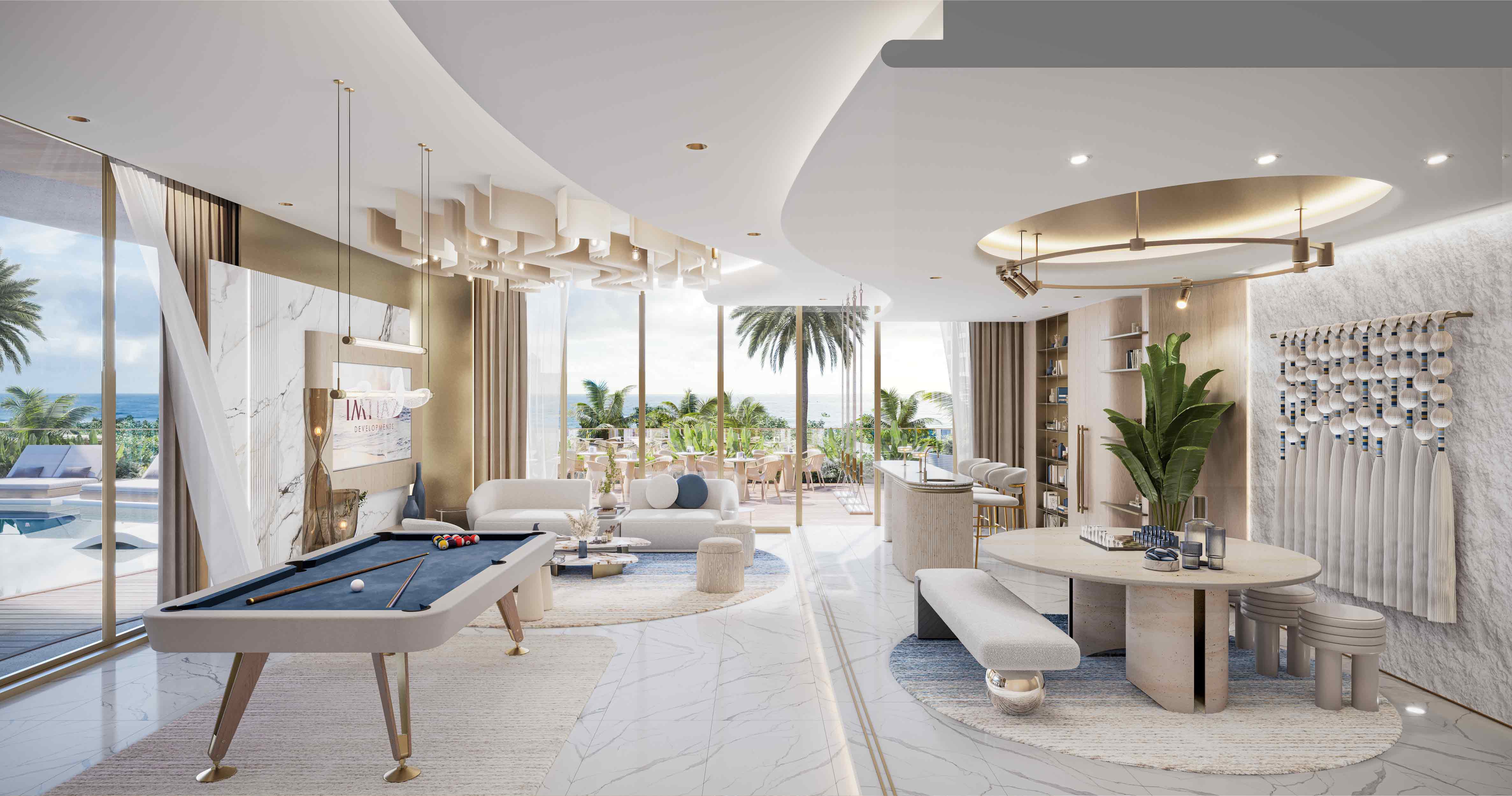 Sunset Bay Grand By Imtiaz A modern living area featuring a pool table, elegant furniture, and large windows with a view of palm trees and ocean.